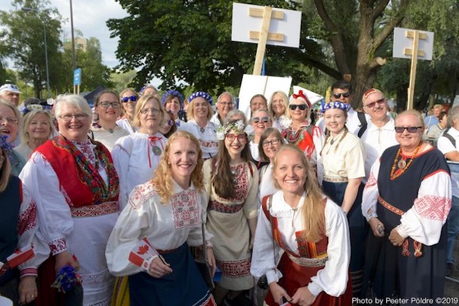 Members of the Estonia Choir at this summer’s 150th Anniversary of Estonia’s Song and Dance Festival inn between singing with about 25,000 other choristers under the huge band shall in Tallinn. Photo by Peeter Põldre (2019)